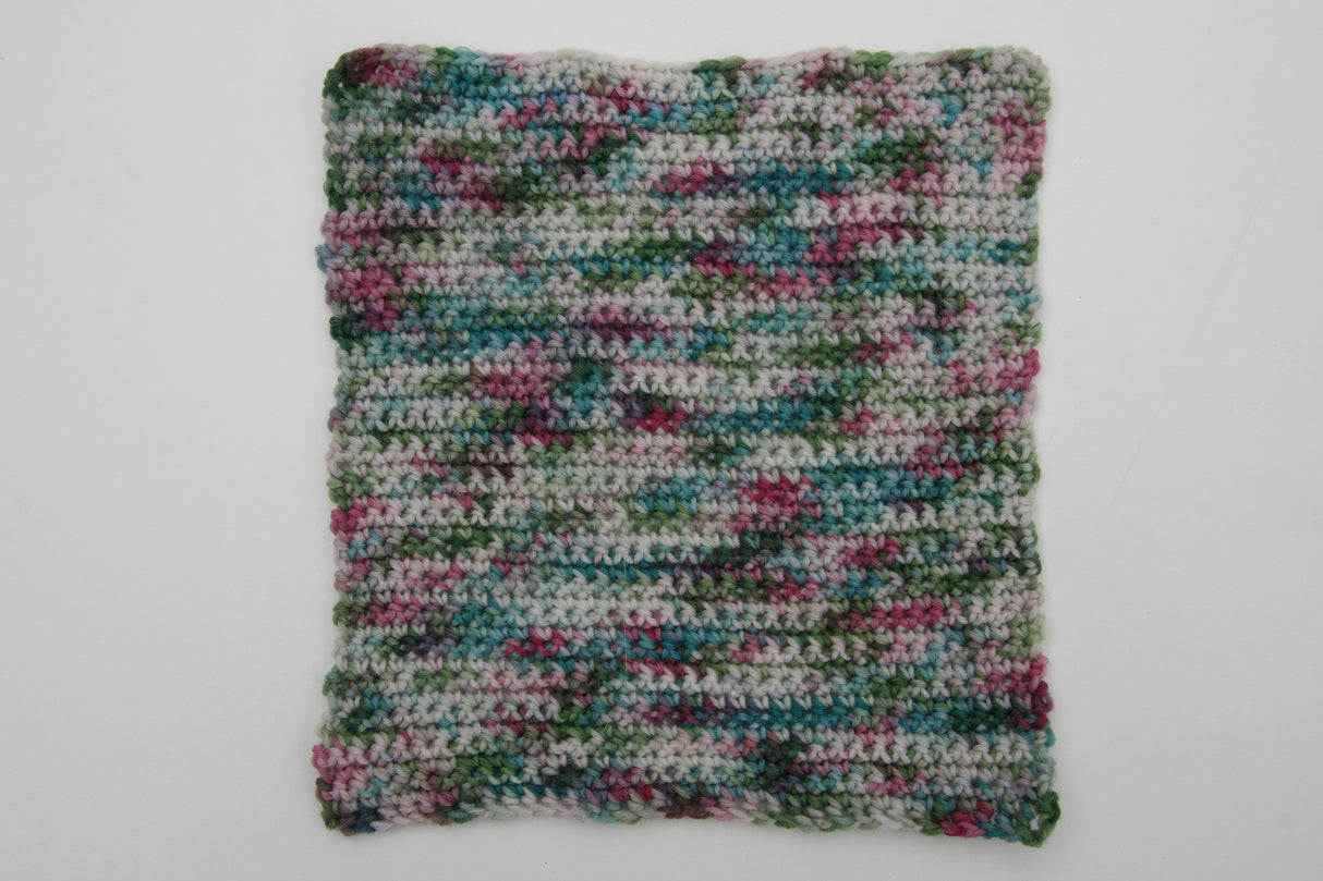 a crocheted swatch of blackberry brambles showcases the variety of color in this yarn.