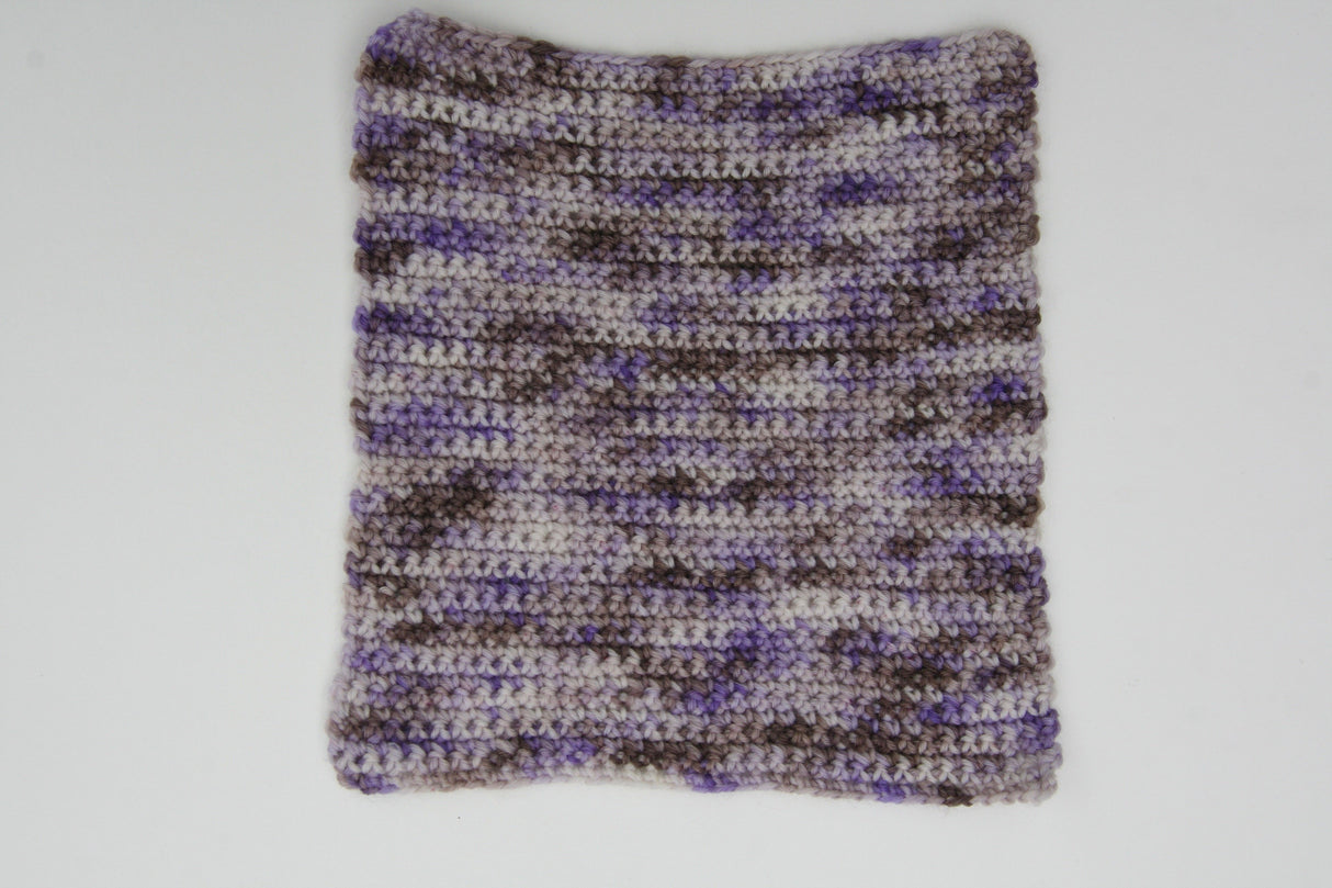 a crocheted swatch showcases the variety of color in this yarn.
