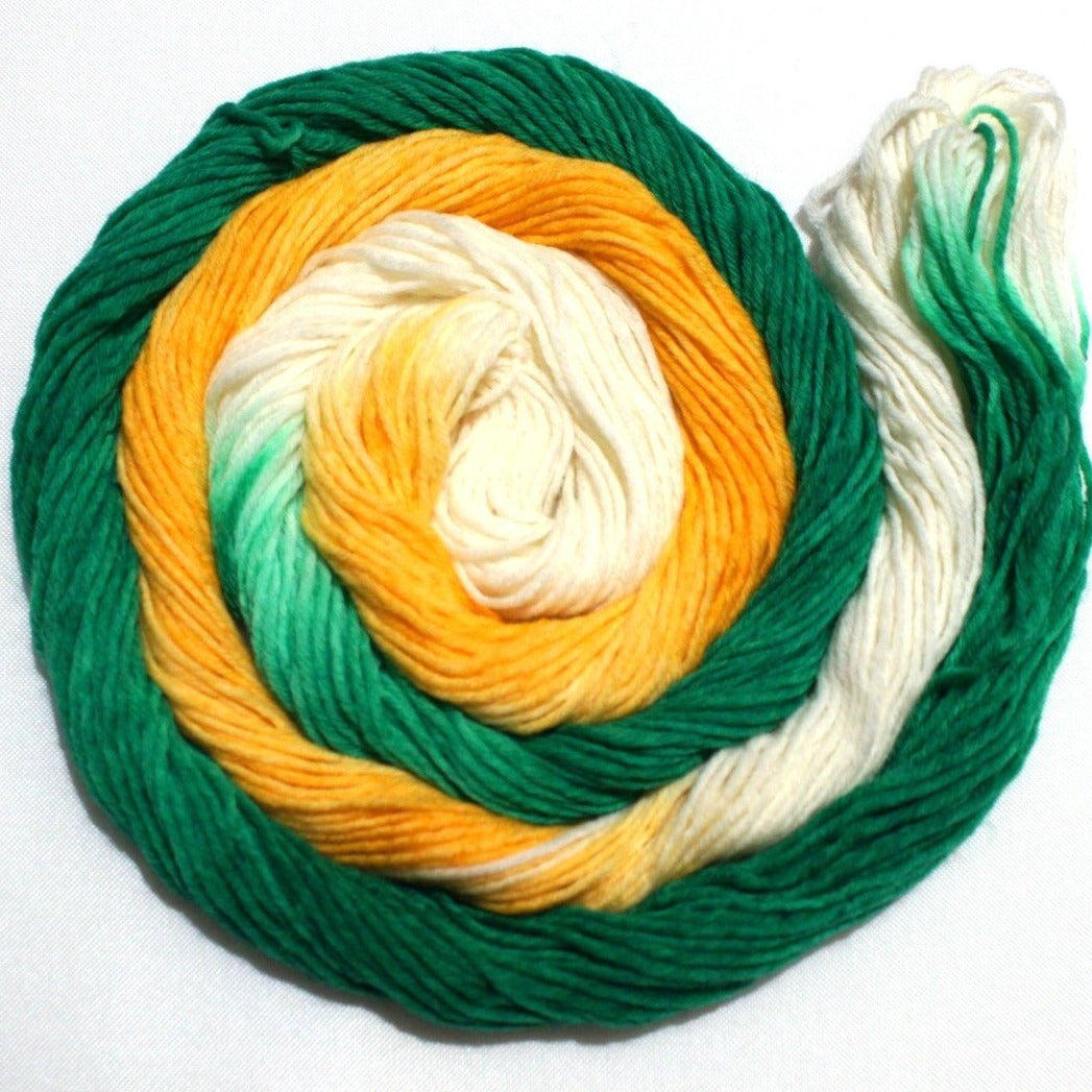 a whorl of yarn rests against a white background.