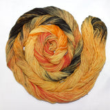A mesmerizing swirl of golden yellow, smudges of inky black and luminous orange.