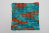 a crocheted swatch showcases this colorway's array of tones.